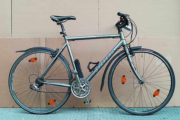 The Stevens trekking bike has been with me on the week-long rides somewhere in Germany every year. It is rugged enough for dirt roads and has enough gears to climb comfortably.